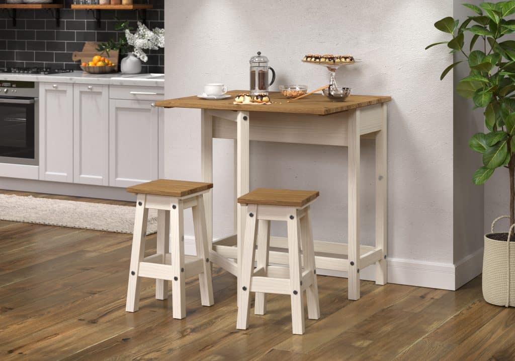 White drop-leaf breakfast table with two stools