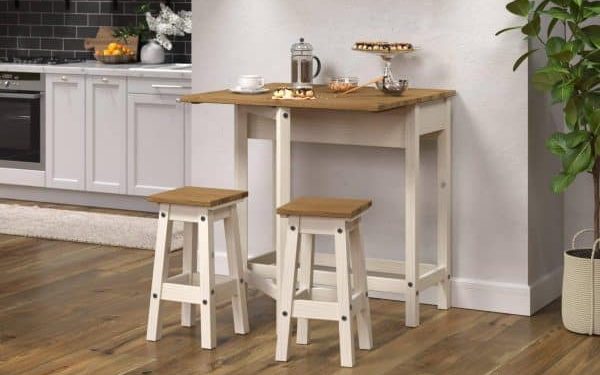 White drop-leaf breakfast table with two stools